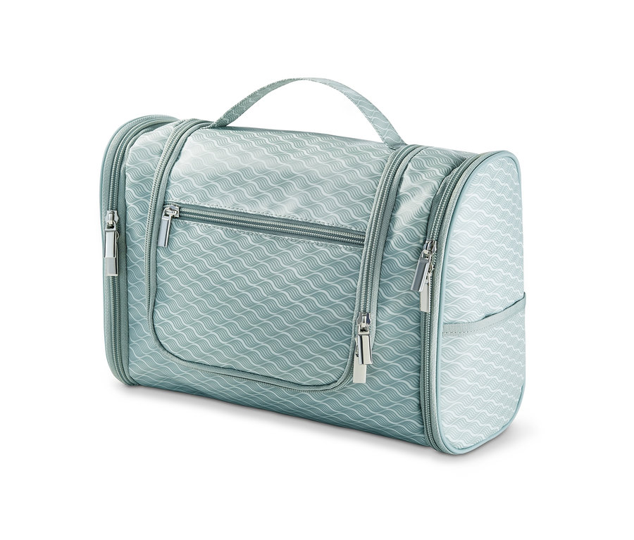 Hellblaue Kulturtasche zum Aufhängen mit gewelltem Muster und silbernen Reißverschlüssen.