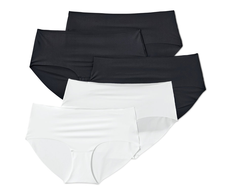 Auf dem Bild sind fünf Magic-Cut-Pantys, weiß und schwarz, übereinander angeordnet.