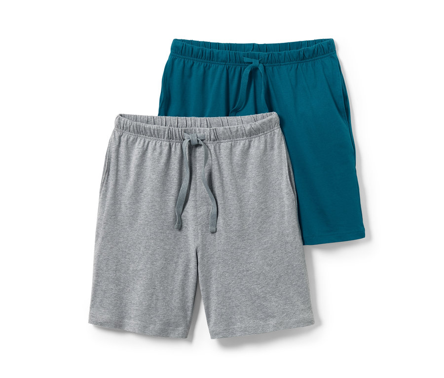 Zwei Pyjamashorts, eine grau und eine blaugrün.