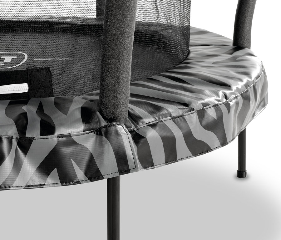 Detailaufnahme eines EXIT Tiggy Junior Trampolins mit schwarzen Beinen und grau-schwarz gemustertem Rand.