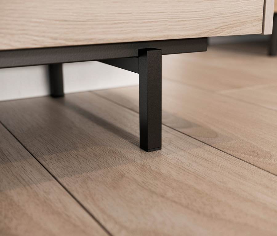 Detailaufnahme vom Fuss eines Cantoria Möbels auf einem Holzboden.