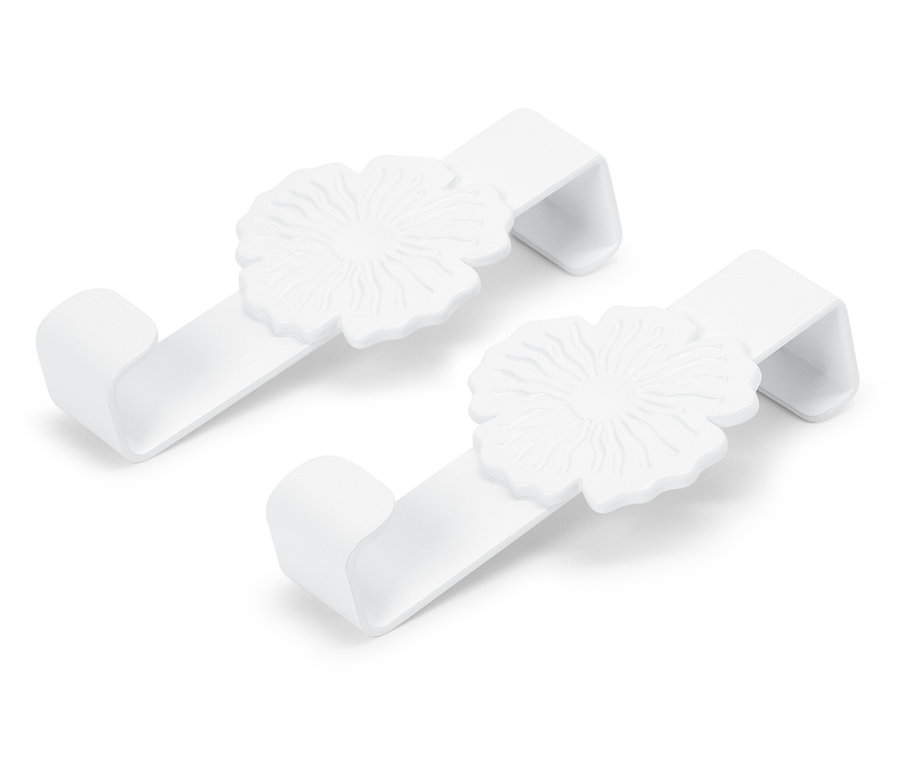 Zwei weiße Haken mit Blumendesign.