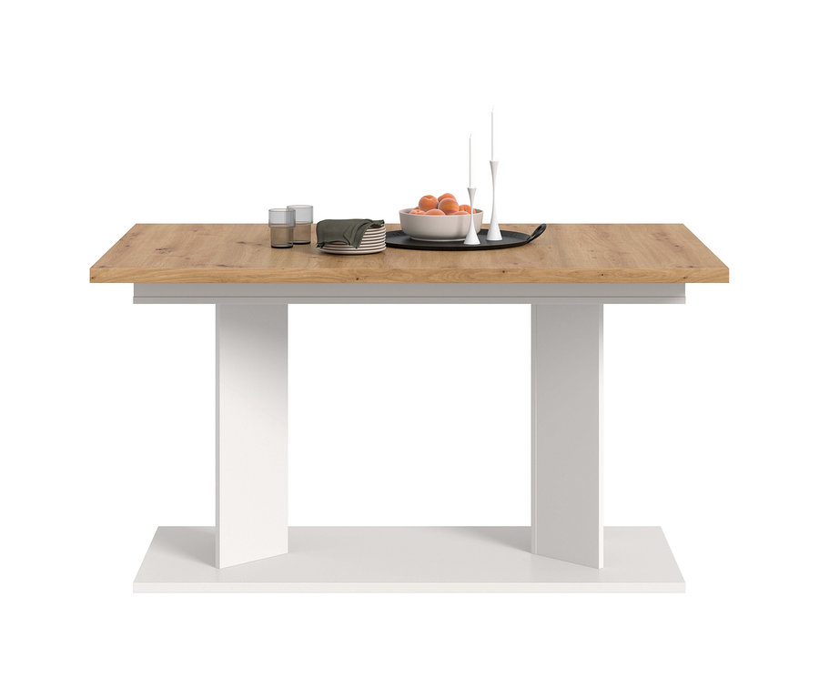 xonox Esstisch Victor XL mit heller Holzplatte und weißem Gestell, darauf eine Schale mit Obst, Teller, Gläser und Kerzenständer.