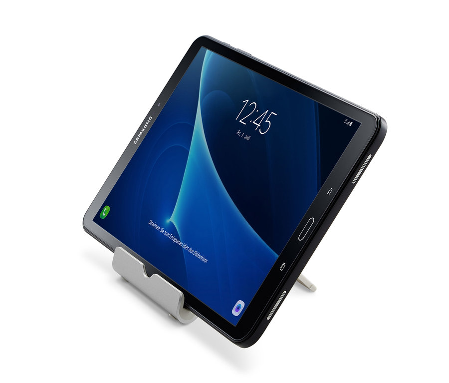 Ein schwarzes Tablet lehnt an einer Smartphone- und Tablet-Halterung.