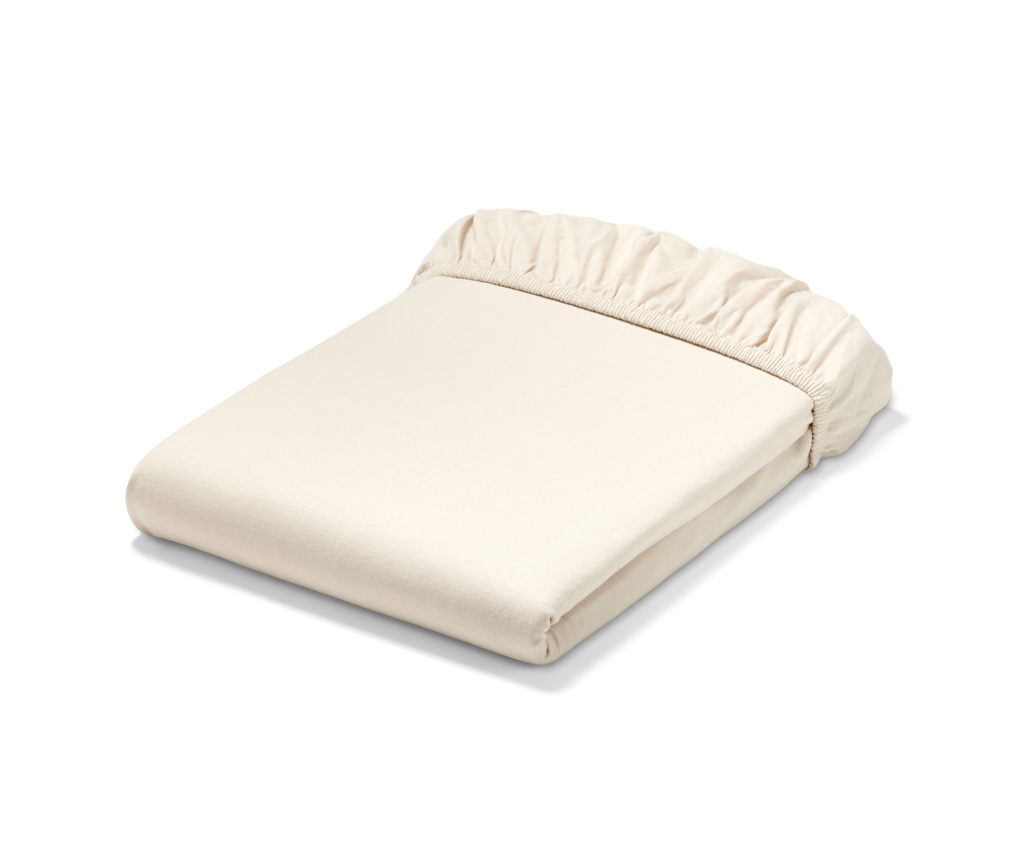 Zusammengelegtes cremefarbenes Premium-Jersey-Spannbettlaken in verschiedenen Größen.