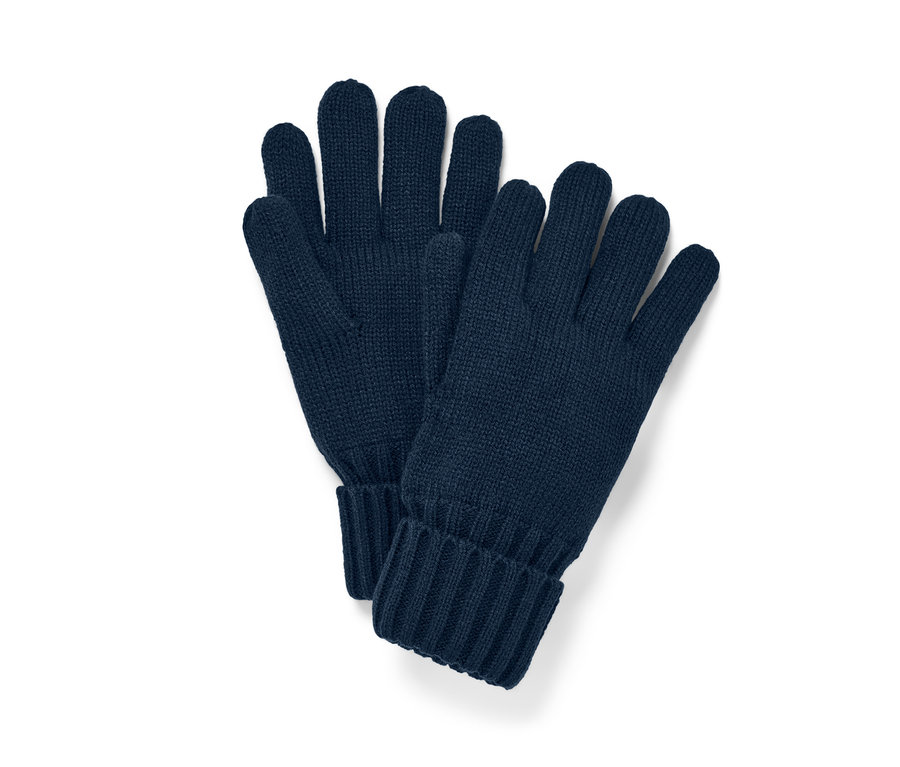 Marineblaue Strickhandschuhe liegen nebeneinander.