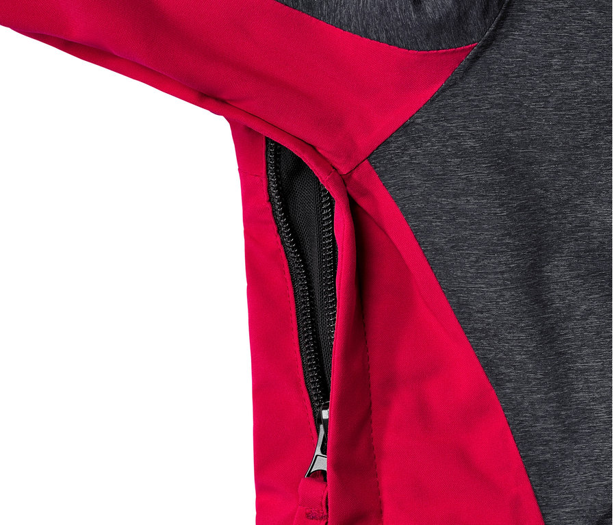 Detailansicht einer grau-roten High-End-Skijacke mit geöffnetem Reißverschluss an der Seite.
