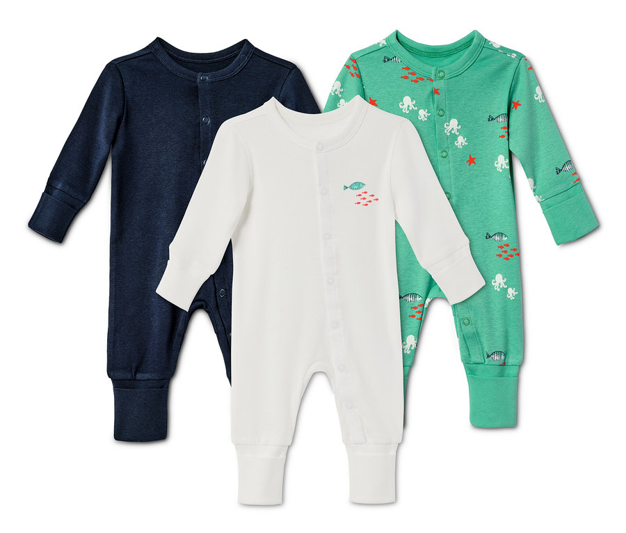Drei Baby Baumwoll-Pyjamas.