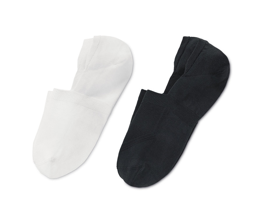 Zwei Paar Sport-Füßlinge, eins in Weiß und eins in Schwarz.