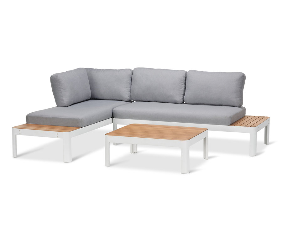 Lounge-Ecke mit höhenverstellbarem Couchtisch mit weißem Rahmen und grauen Kissen.