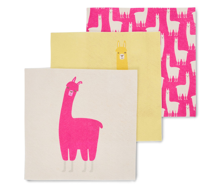 Drei Servietten liegen übereinander, eine mit einem pinken Lama, eine gelbe mit einem gelben Lama und eine pinke mit weißen Lamas.