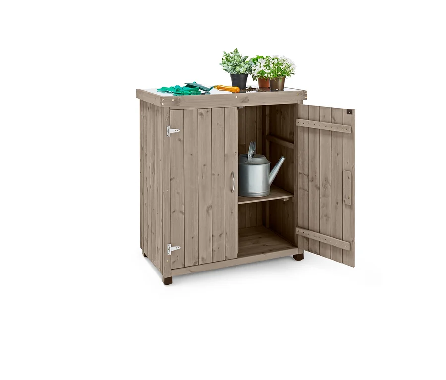 Geöffneter Kleiner Gartenschrank »Jonte« mit verzinkter Arbeitsfläche, auf der sich Topfblumen und Gartenhandschuhe befinden.