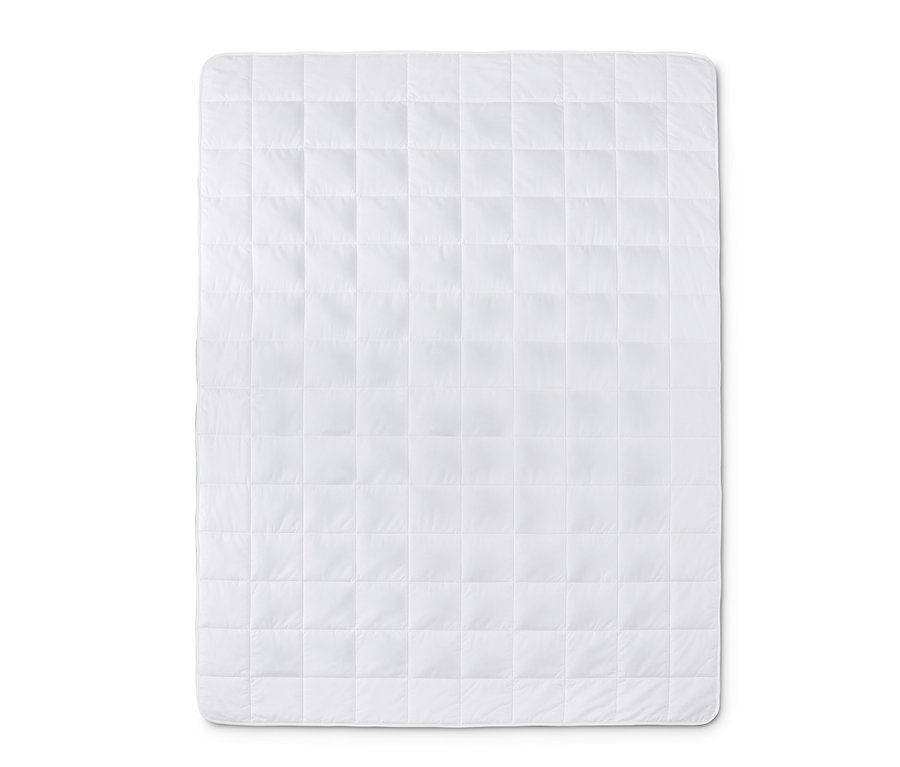 Eine weiße Entspannungs-Gewichtsdecke mit quadratischer Steppung.