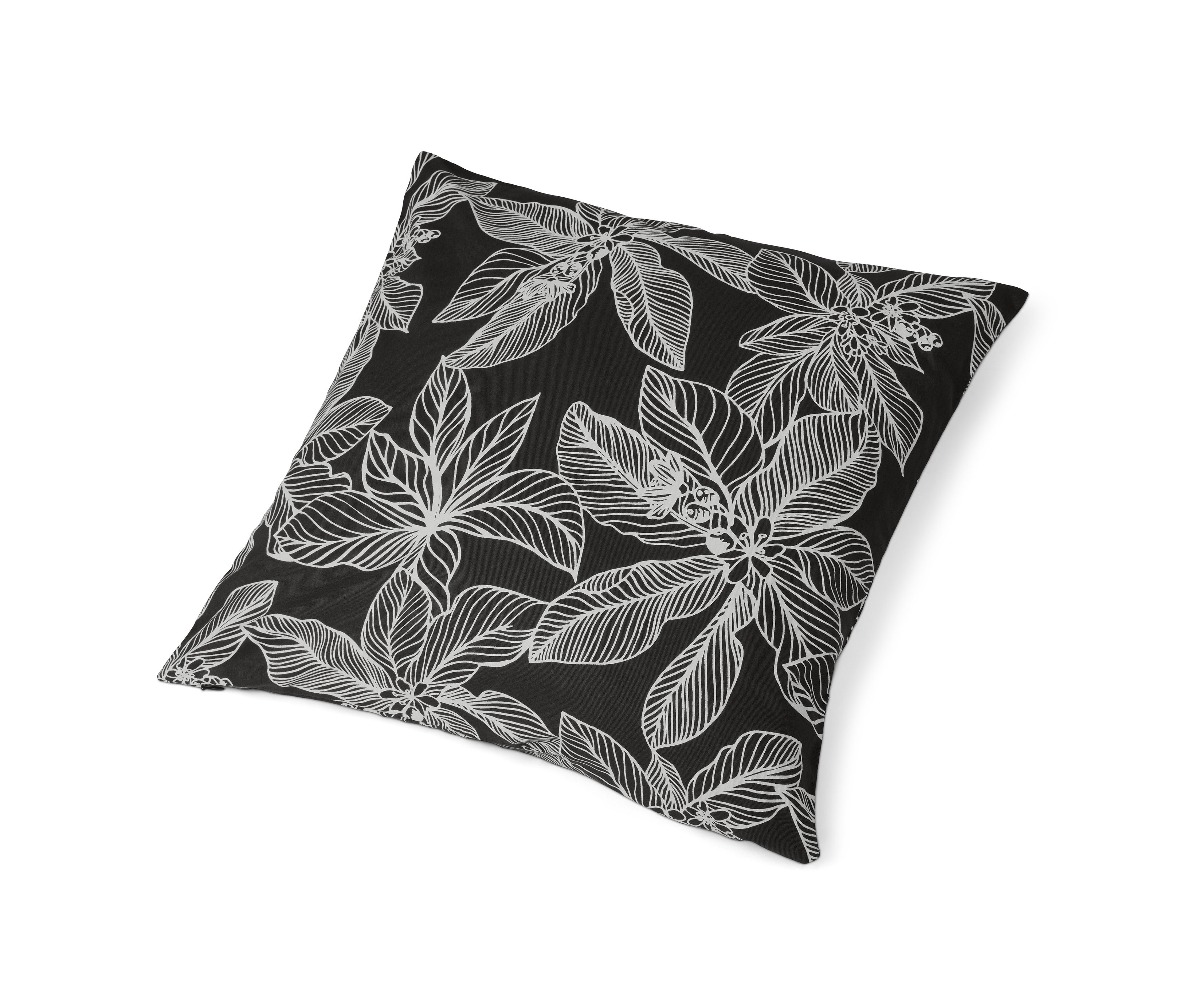 Ein Dekokissenbezug mit schwarzem Stoff und weißem Blumenmuster.