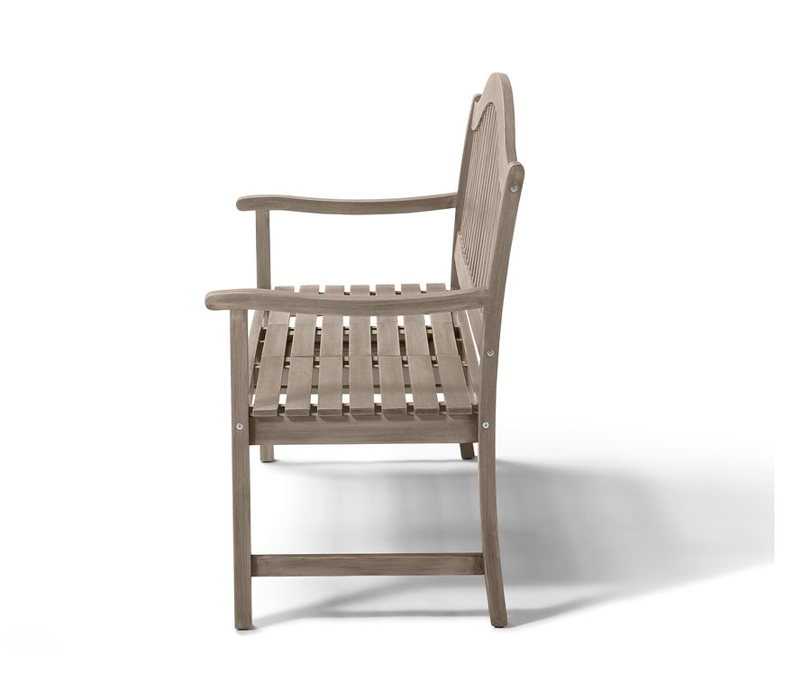 Seitenansicht der Bank »Leira« mit hochklappbarem Tabletttisch auf weißem Hintergrund.