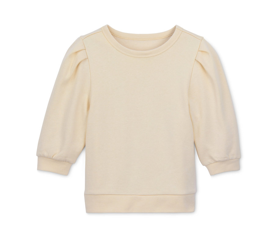 Ein cremefarbenes Cropped-Sweatshirt mit Puffärmeln.