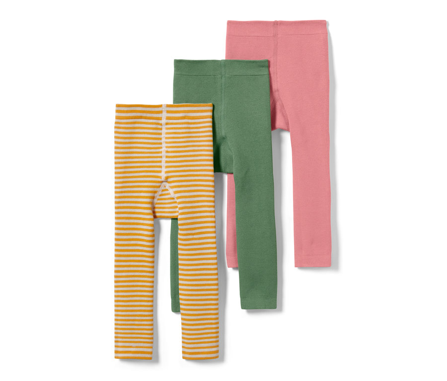 Eine gestreifte orange-weiße, eine grüne und eine rosa Kinder-Thermoleggings, 3er-Pack.