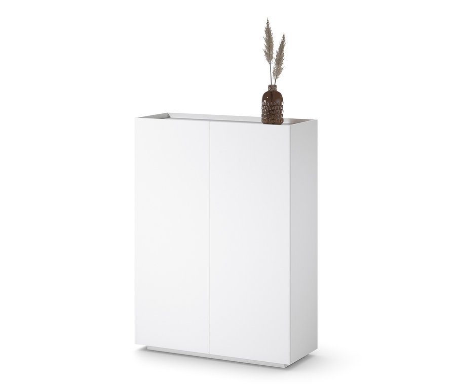 Weißes Highboard mit einer Vase mit Gras darauf.