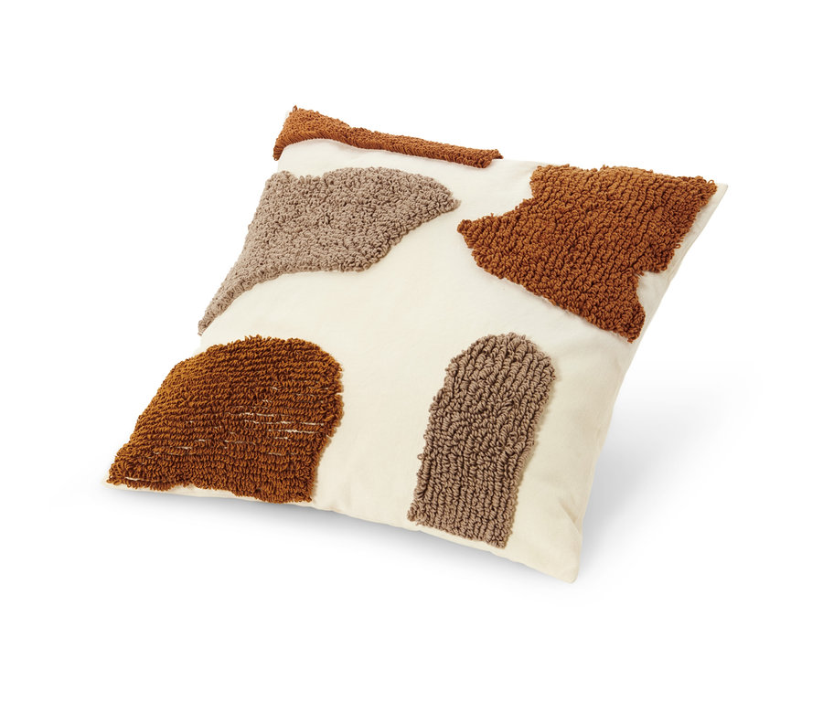 Dekokissen mit Füllung, beige mit braunen und beigen getufteten Mustern.