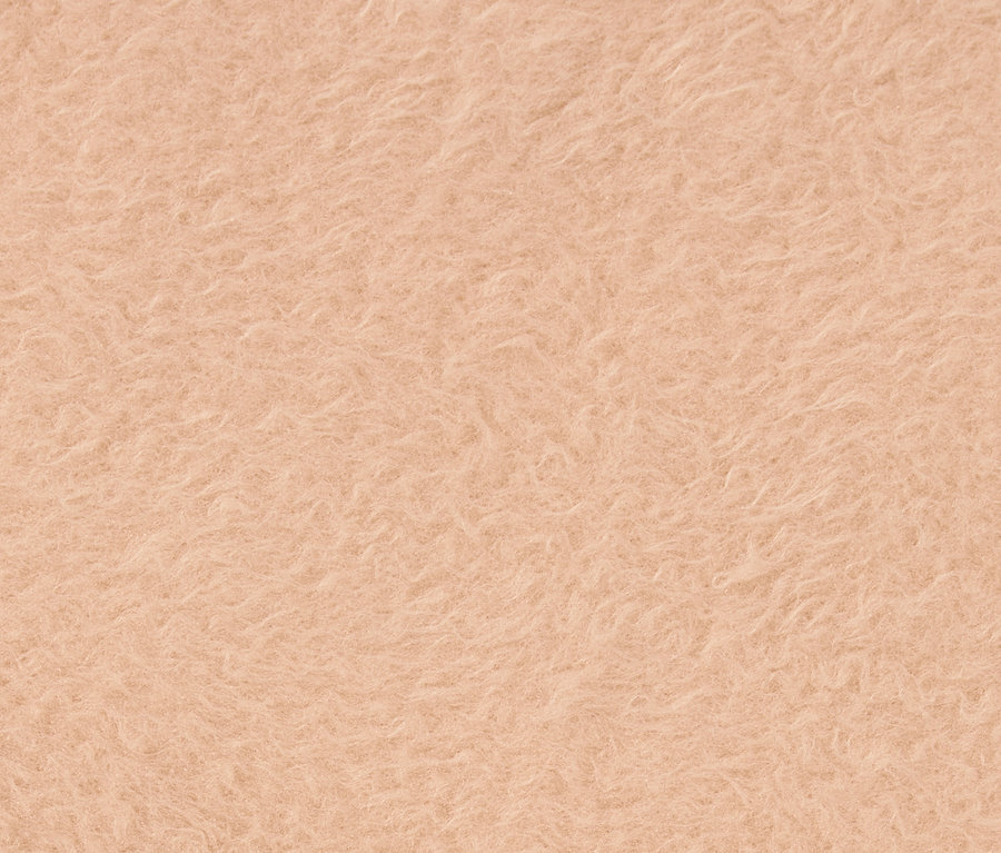 Detailaufnahme der Textur eines hellorangen Stoffes.