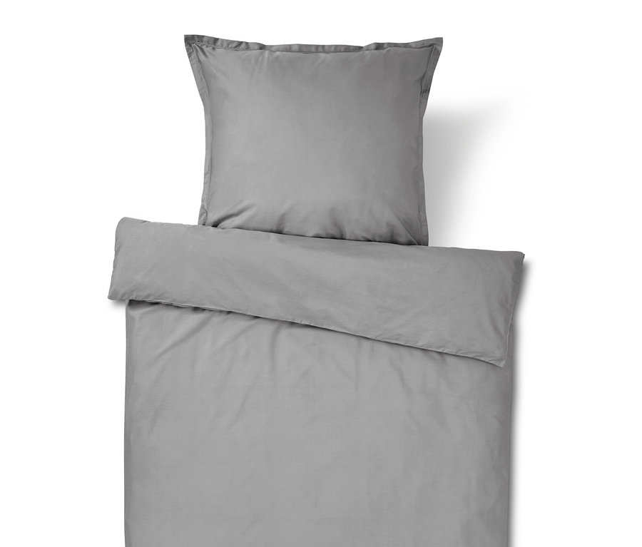 Graue Bettwäsche mit Kissenbezug.