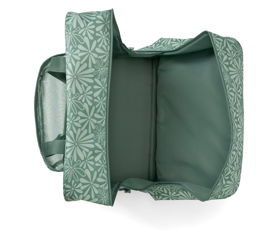 Geöffnete Nähmaschinentasche mit grünem Blumenmuster.