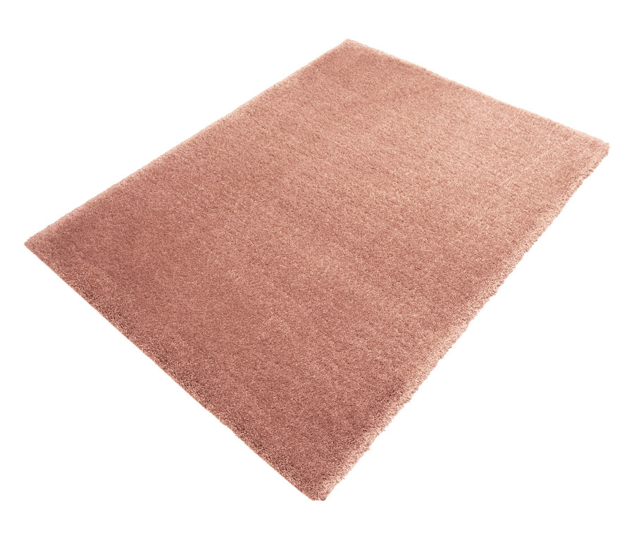 Nahaufnahme eines rechteckigen, rostfarbenen Teppichs »Pleasure« vor einem weißen Hintergrund.