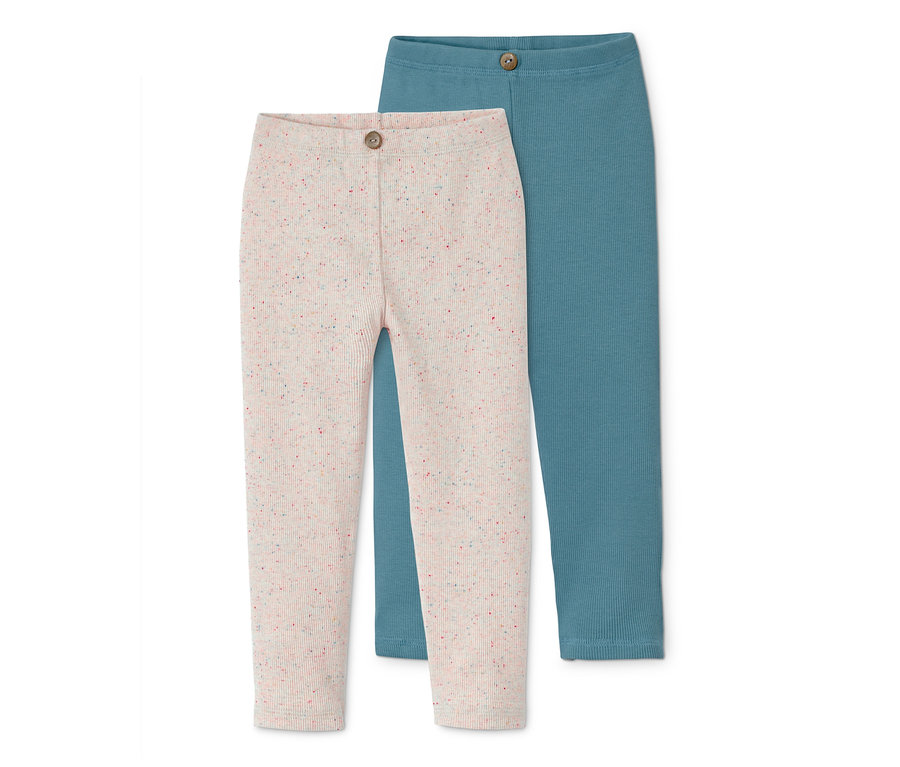 Zwei gerippte Leggings: eine cremefarbene mit bunten Sprenkeln, die andere blaugrün.