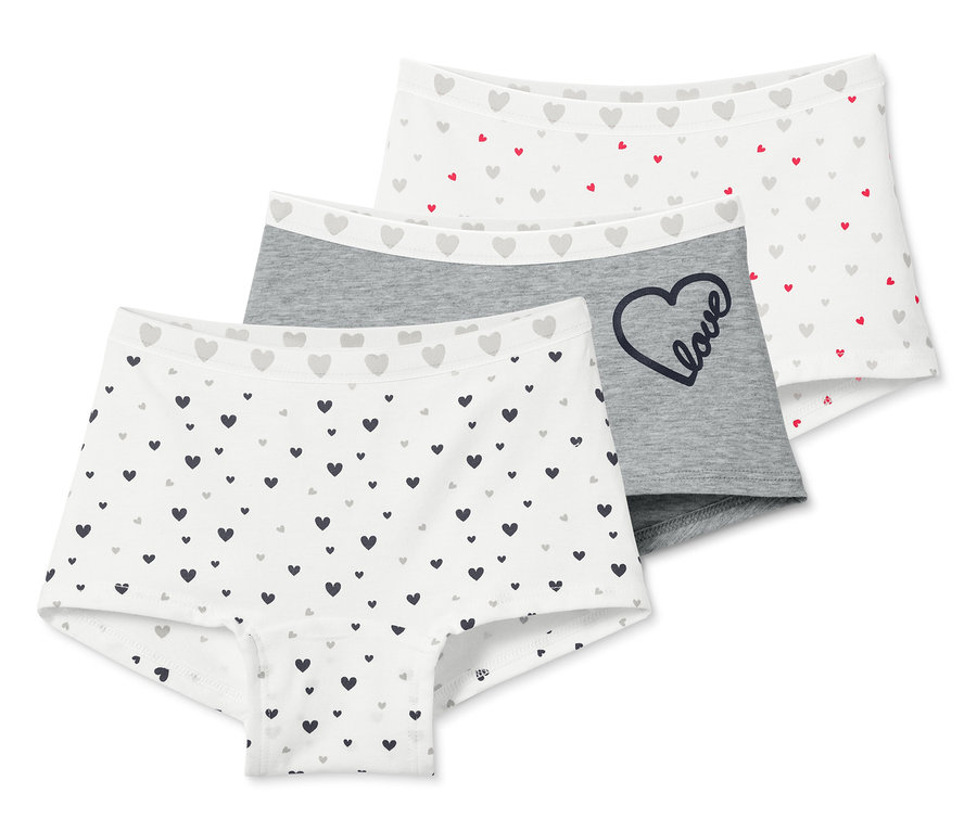 Drei Mädchen-Pantys mit Herzchenmuster.