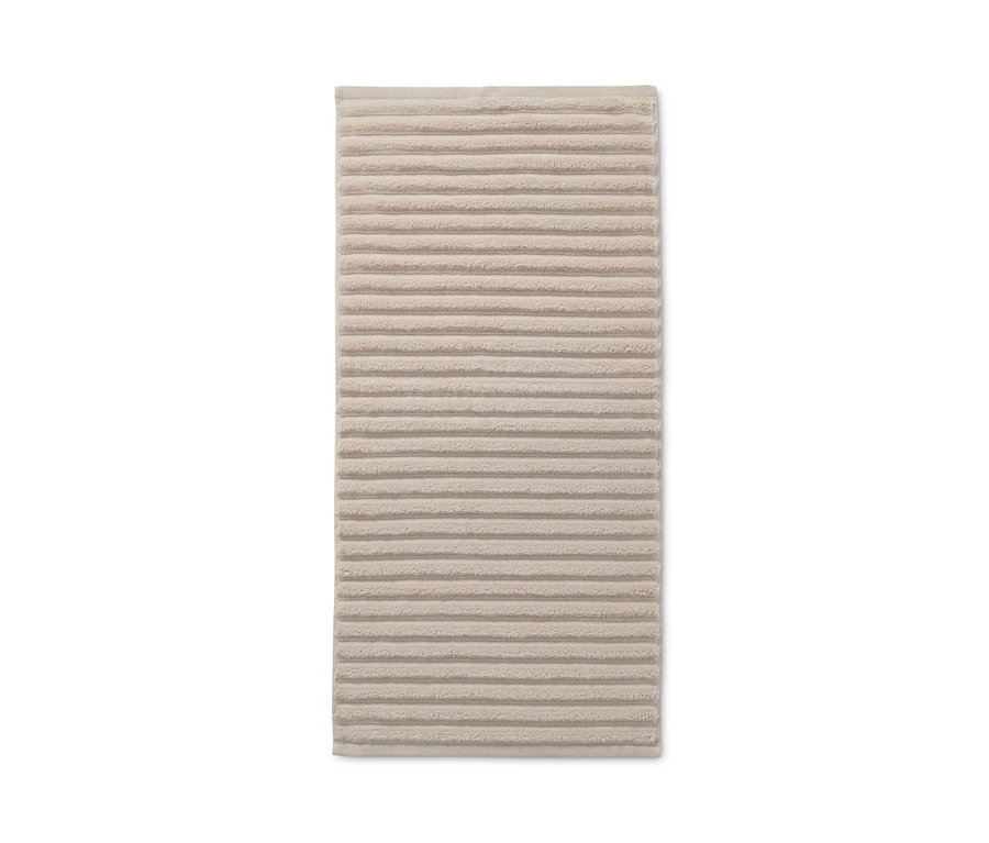 Ein beiges Premium-Handtuch mit Wellenstruktur aus einem 2er-Set.