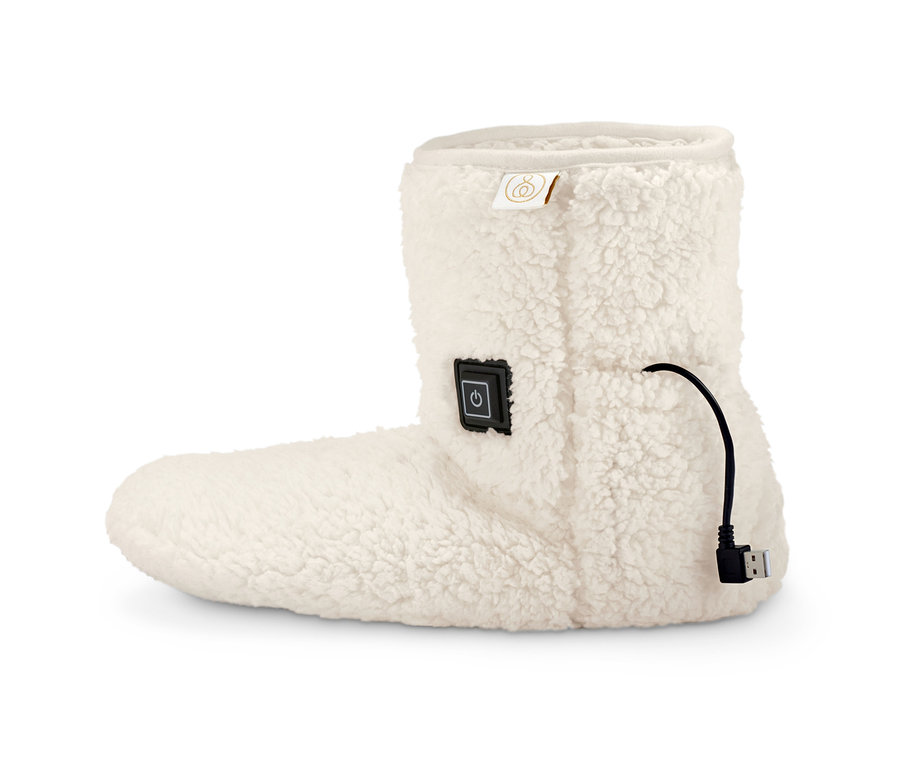 Ein einzelner weißer Akku-Heizschuh vor einem weißen Hintergrund.