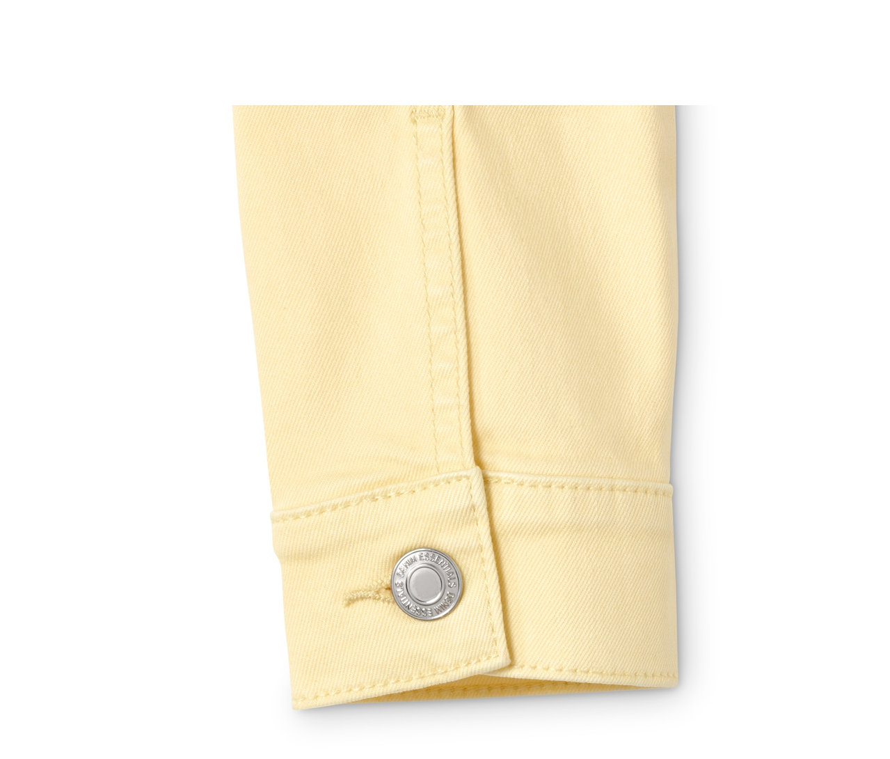 Detailansicht einer gelben Jeansjacke.