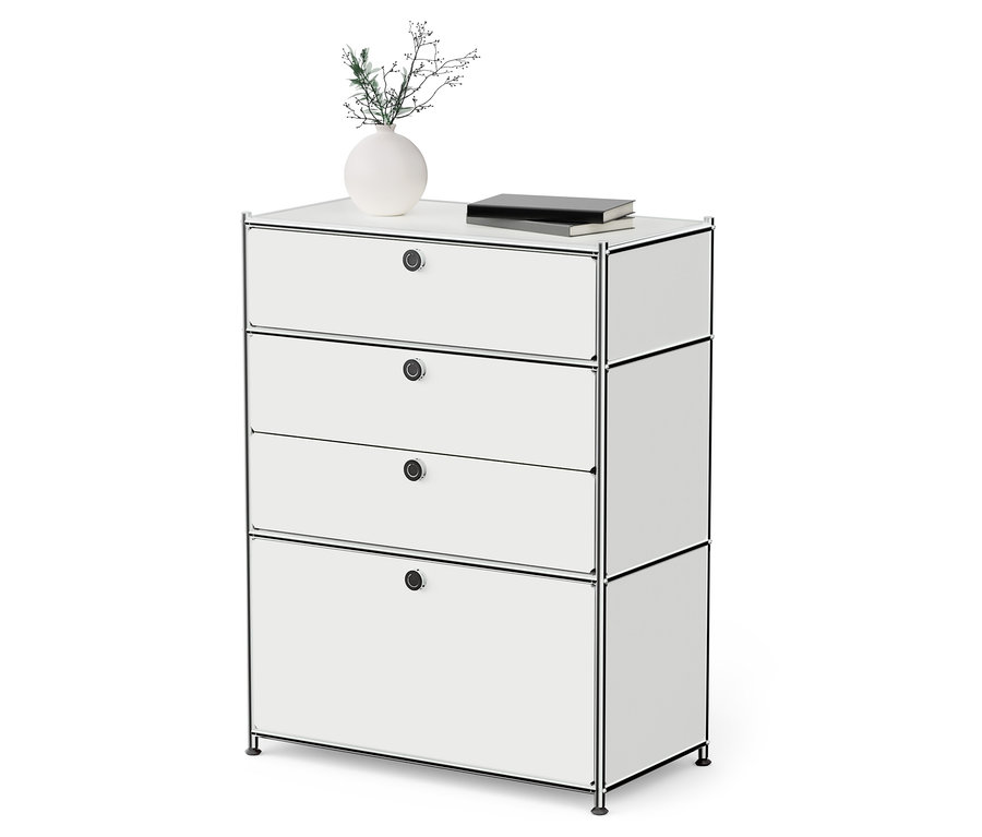 Weiße Metallkommode »CN3« mit 3 Schubladen und Klappenfach. Auf der Kommode stehen eine Vase mit Pflanze und ein Buch.