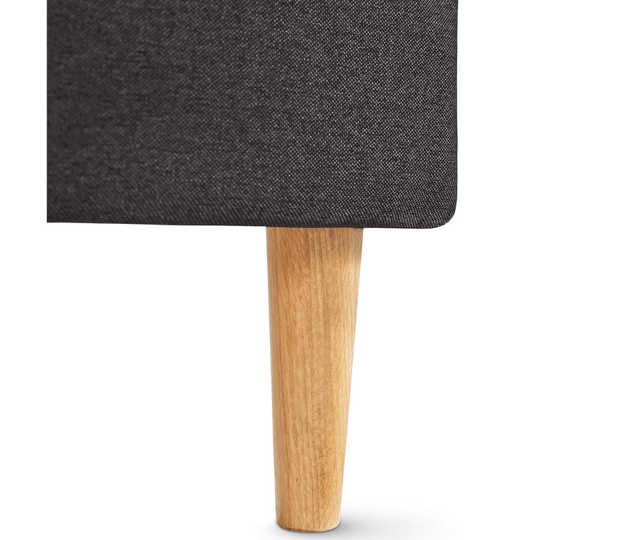 Nahaufnahme des dunkelgrauen Federkern-Eckschlafsofas »Just Relax« mit hellem Holzbein.