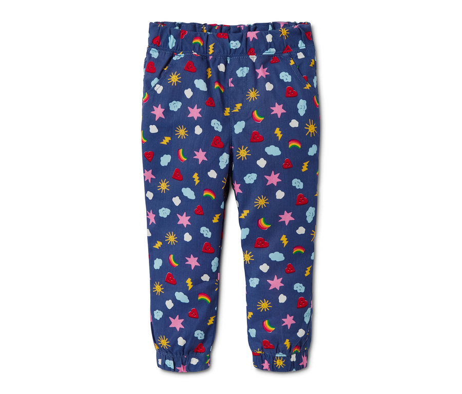 Blaue Schlupfhose aus Bio-Baumwolle mit Alloverprint aus Sternen, Herzen, Wolken, Regenbögen und Blitzen.