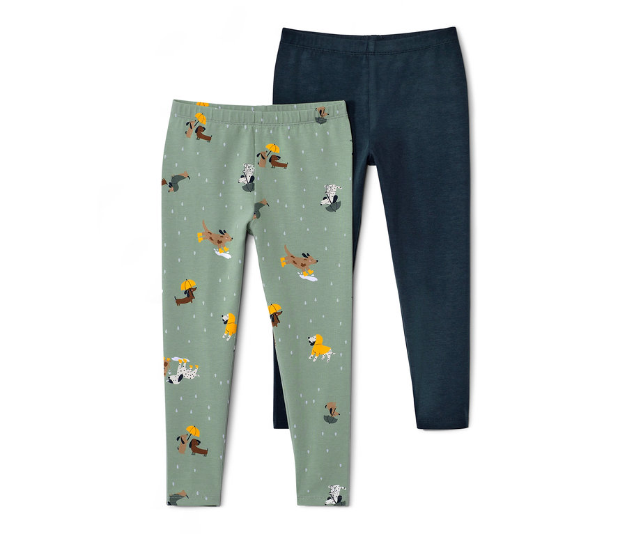 Zwei Kinder-Leggings: eine hellgrüne mit Hundeprint, eine dunkelblaue.