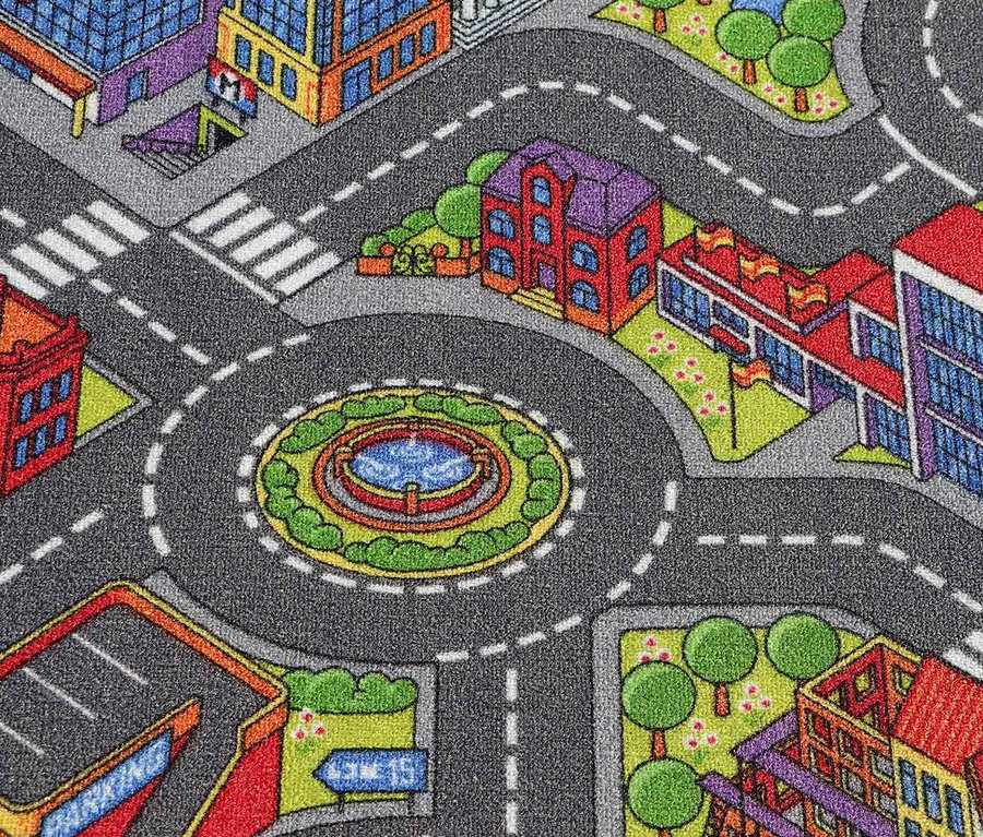 Detailansicht eines Spielteppichs »BIG CITY« mit einem Stadtmotiv, mit Gebäuden, Straßen und einem Kreisverkehr in der Mitte.