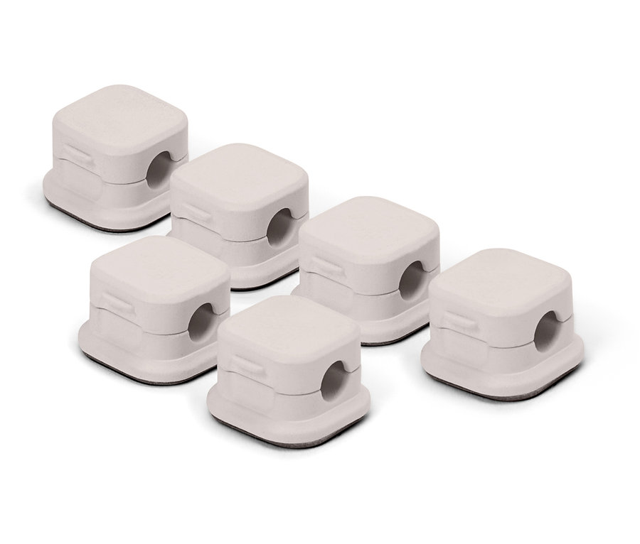 Sechs weiße Kabelabdeckungen.