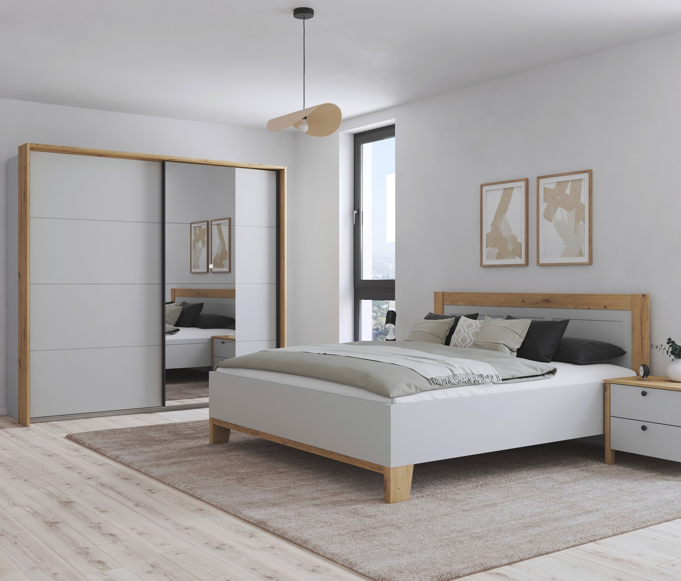 Schlafzimmer mit grauweißem Bett und Nachttischen neben einem zweitürigen Kleiderschrank mit Spiegel.