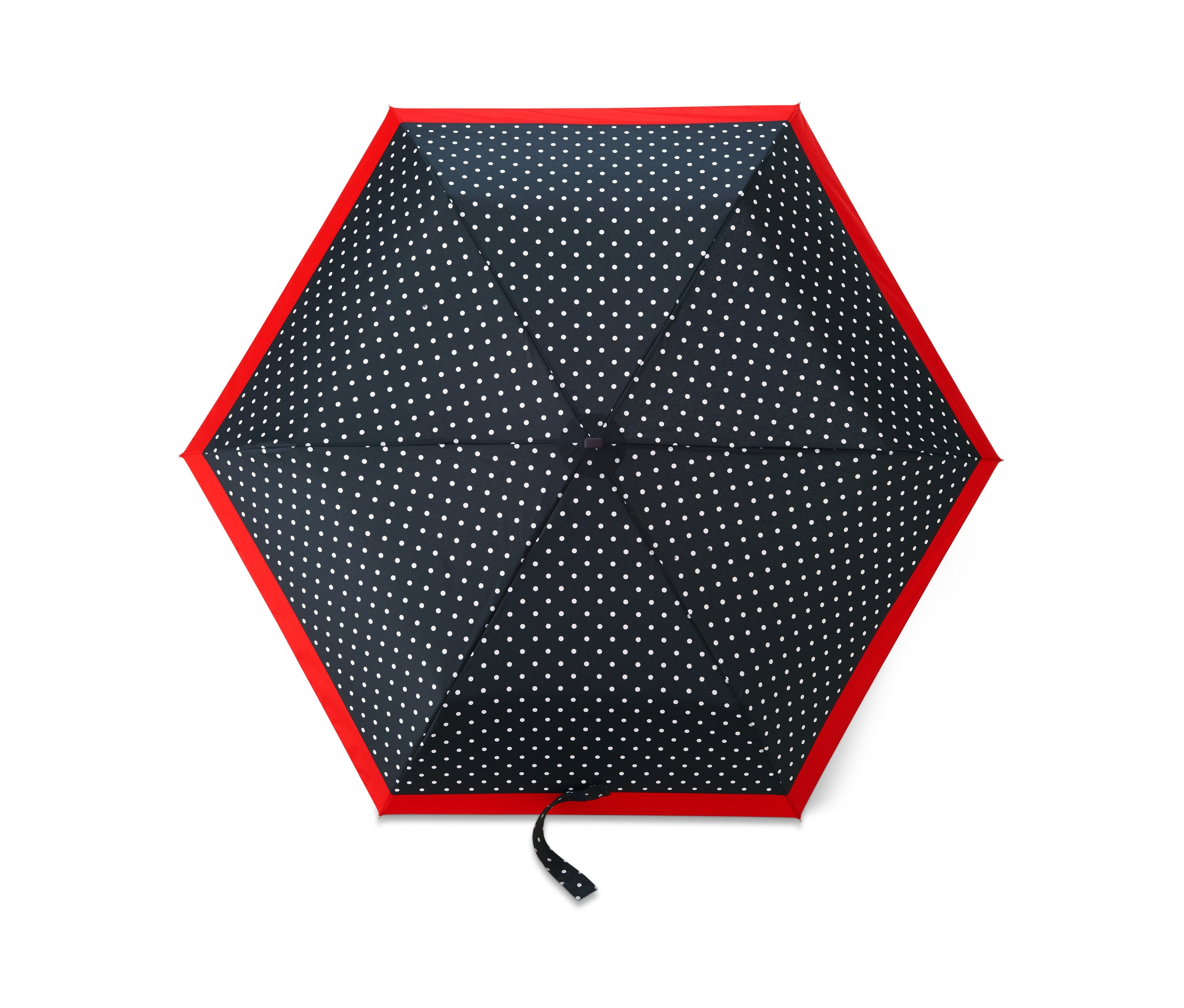 Nahaufnahme eines Taschenschirms mit dunkelblauem Hintergrund und weißen Punkten, eingefasst in Rot.