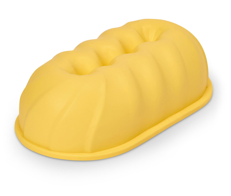 Gelbe, längliche Kuchenform mit gerippter Oberseite.
