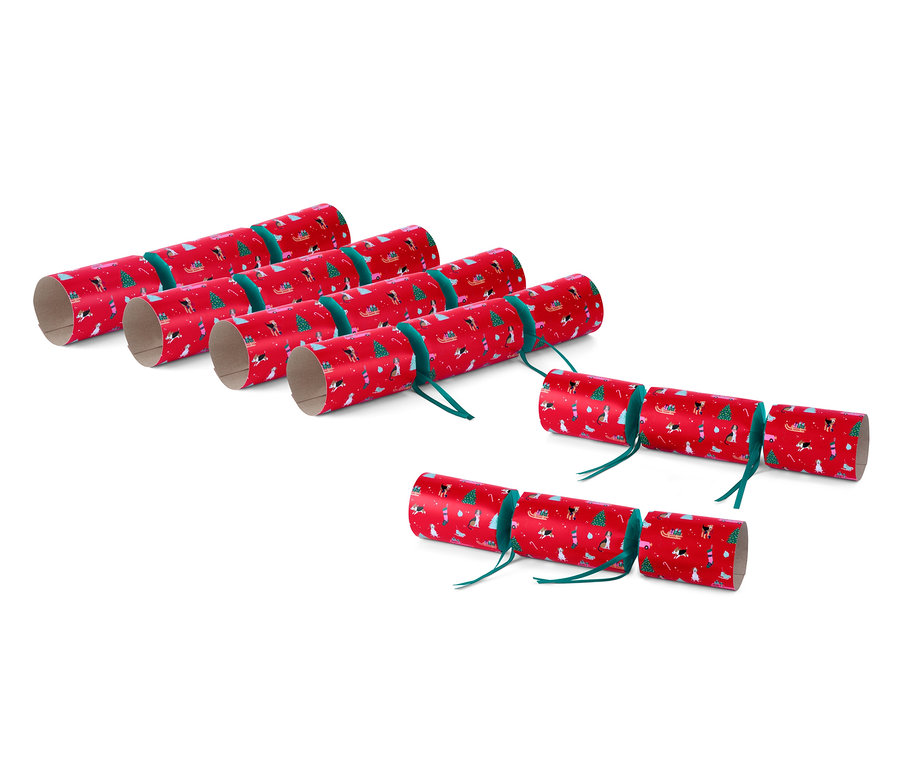 Sechs rote DIY-Überraschungsbonbons mit Weihnachtsmotiven.