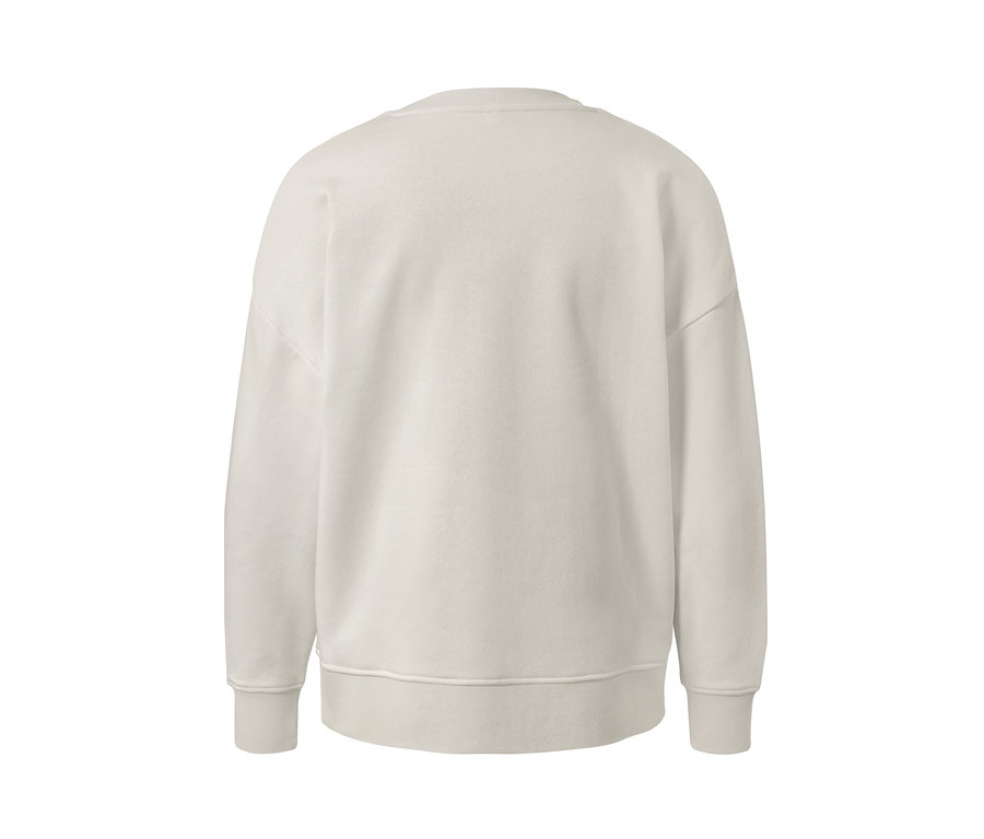 Detailansicht eines cremefarbenen Sweatshirts.