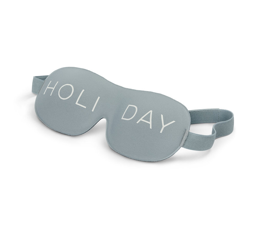 Eine blaue 3D-Schlafmaske mit dem Aufdruck "Holiday".