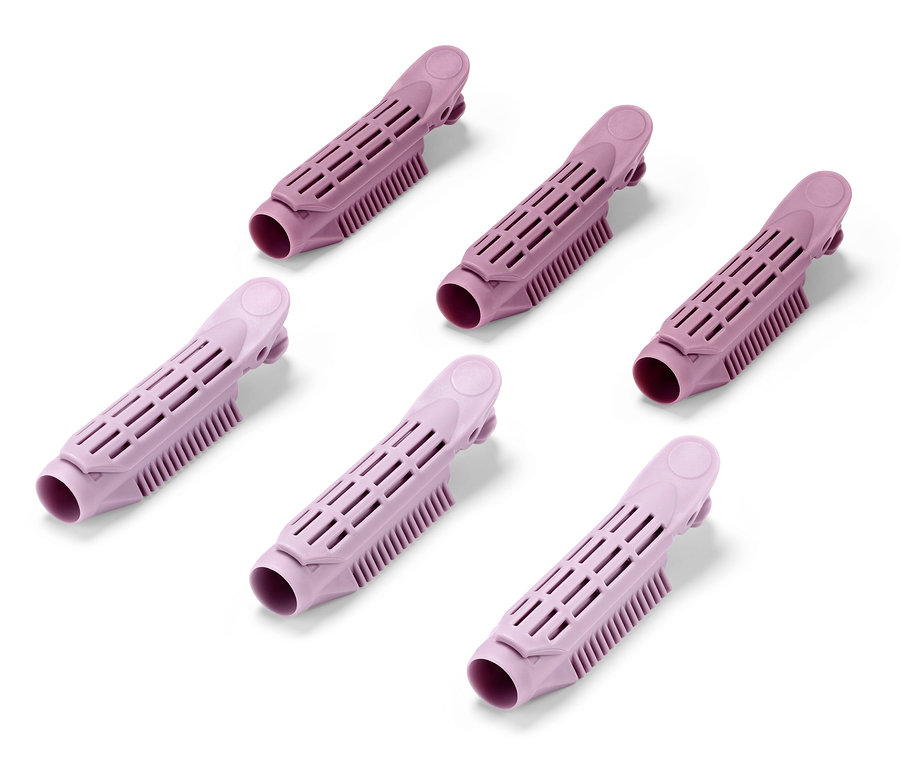 Sechs rosa Ansatz-Volumen-Clips auf weißem Hintergrund.