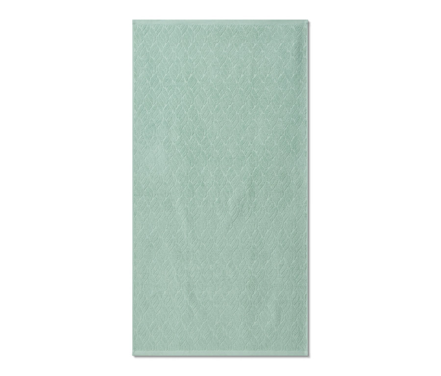 Ein grünes Premium-Badetuch mit Textur.
