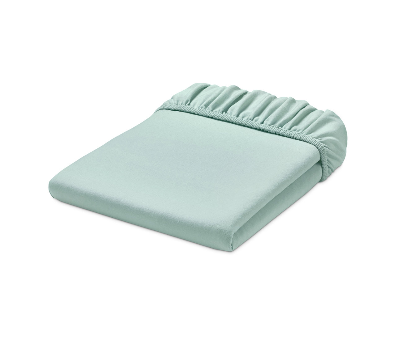 Hellgrünes Jersey-Spannbettlaken ordentlich gefaltet.