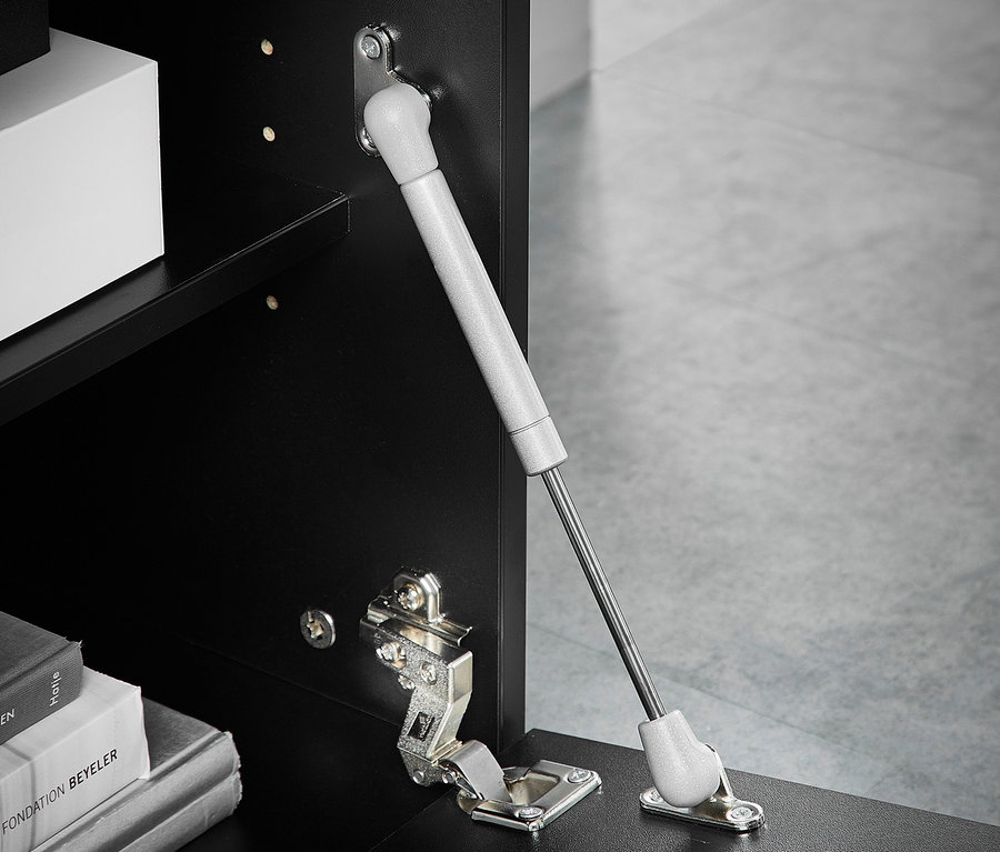 Detailansicht einer offenen schwarzen Highboard »Ideeus«-Tür mit Scharnier und Gasdruckfeder.