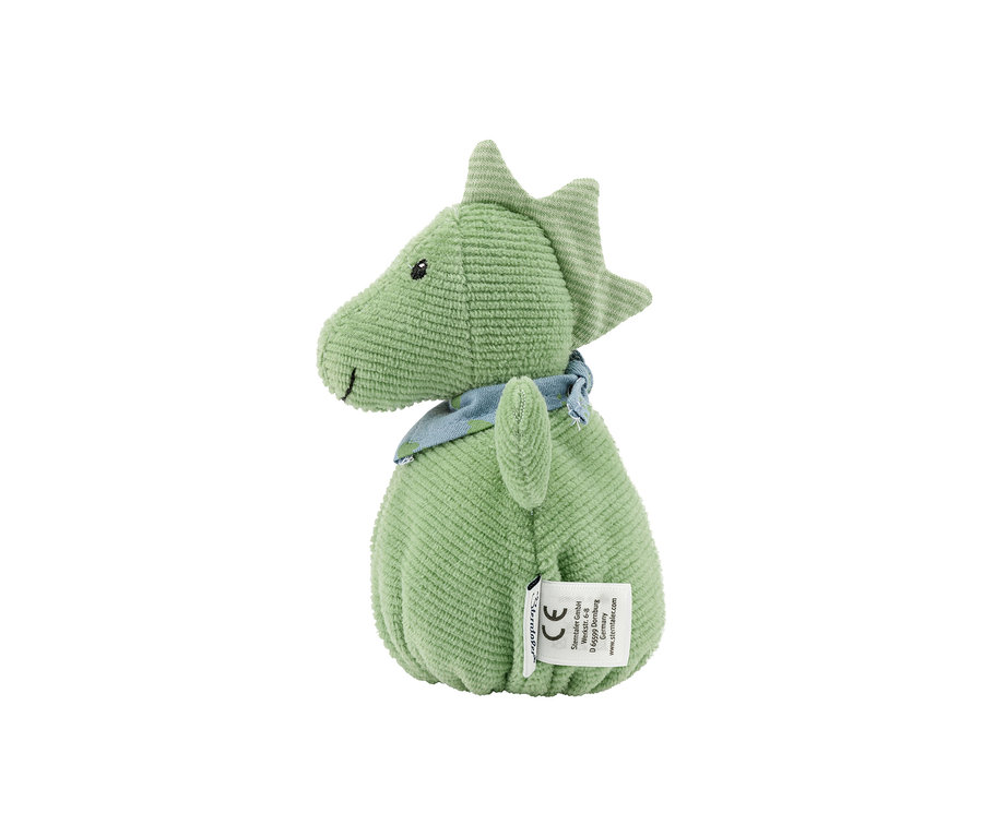 Grünes Plüsch-Dinosaurier-Spielzeug aus Cordstoff mit kleinen schwarzen Augen, einem aufgestickten Lächeln und einem blau-grün gemusterten Halstuch, mit einem weißen Etikett an der Seite.