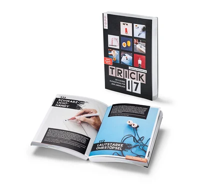 Ein aufgeschlagenes Buch „Trick 17“ mit Beschreibungen von Alltagstricks.